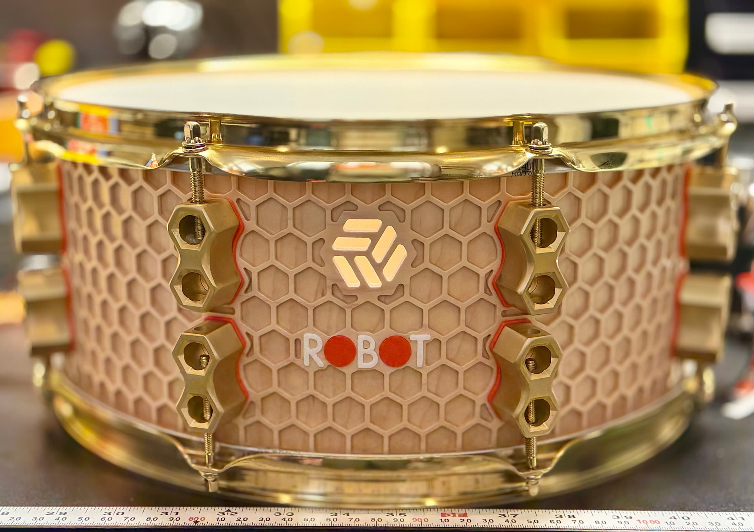 Hive Series snare with honeycomb shell geometry and brass hardware.