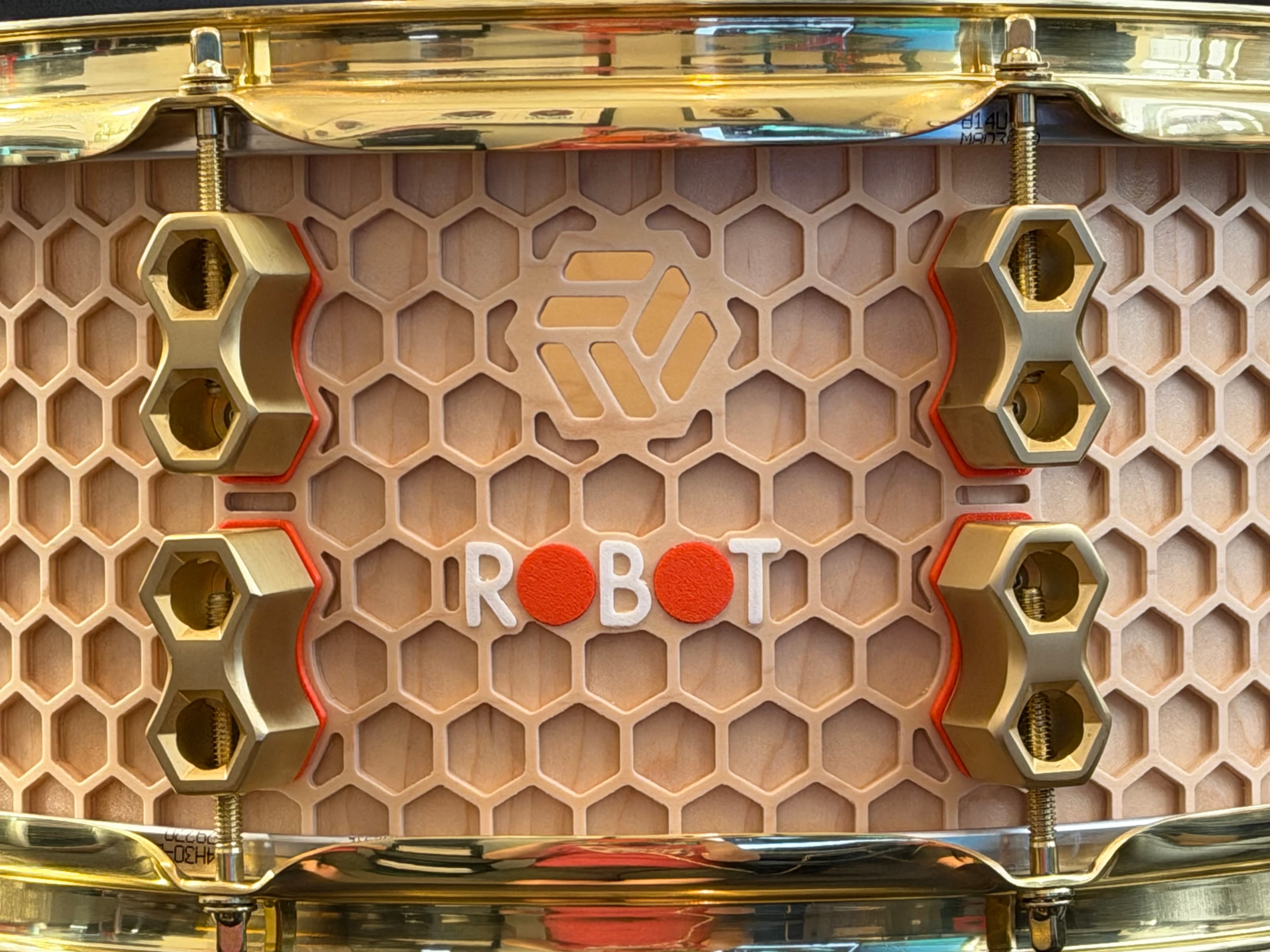 Hive Series snare with honeycomb shell geometry and brass hardware.